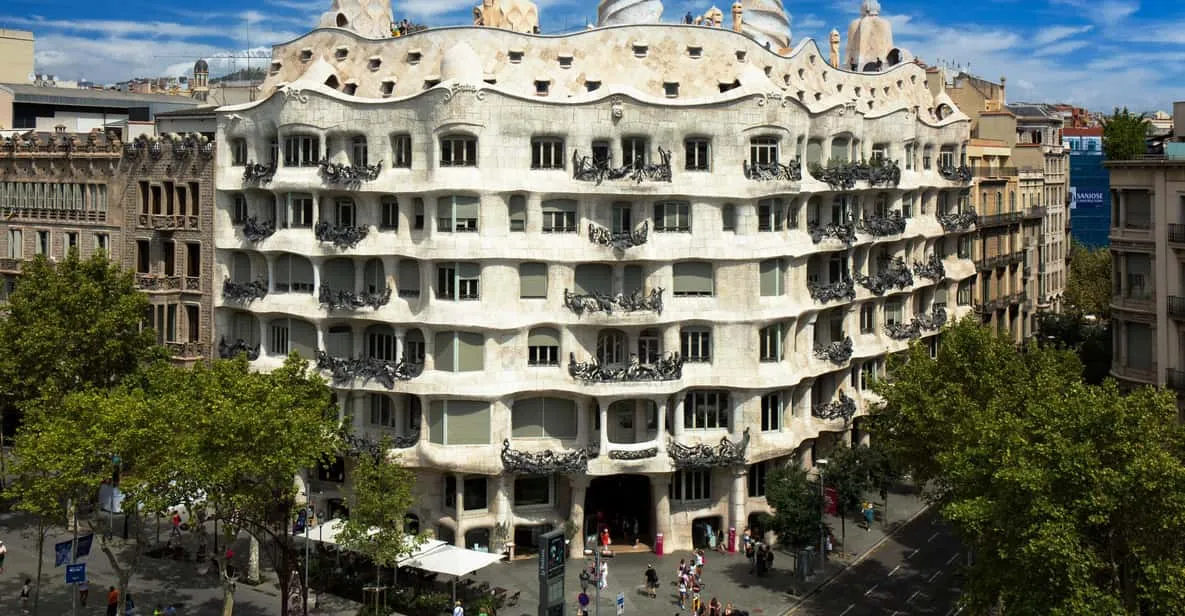 Undulating stone façade and rooftop chimneys of La Pedrera, one of the modernista museums in Barcelona, Spain